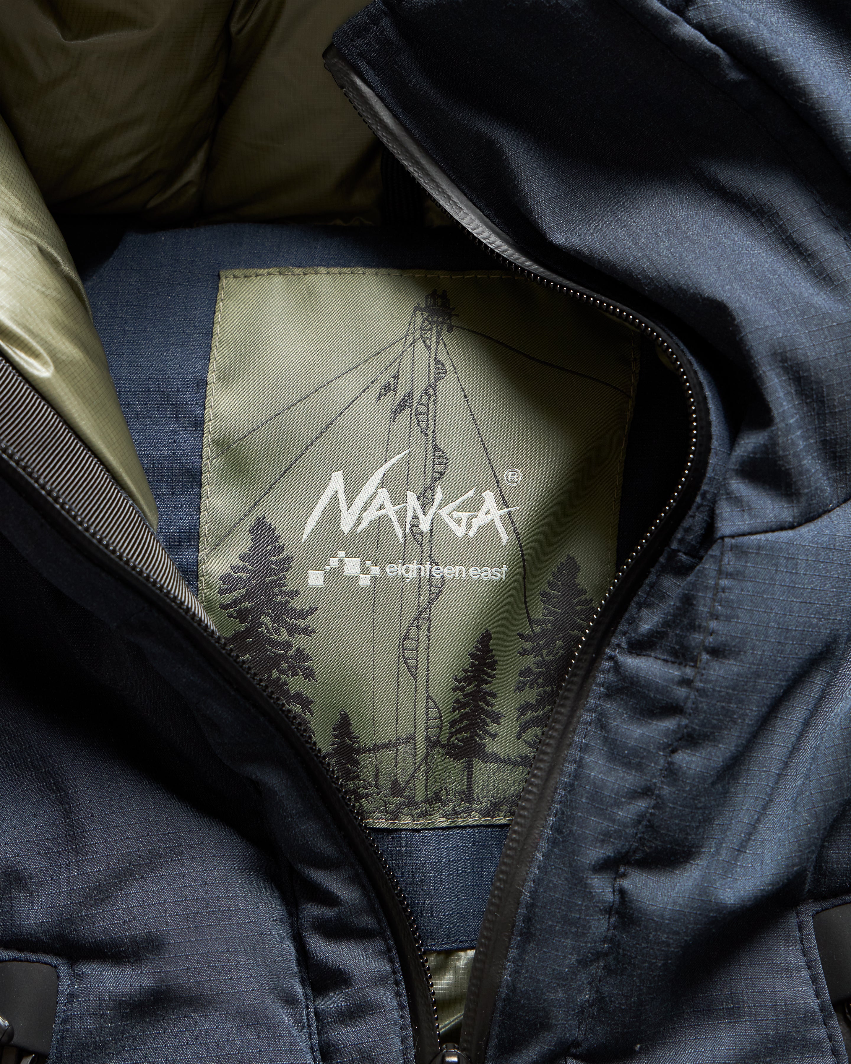 18 EAST / NANGA HOODED LOOKOUT DOWN JACKET - NAVY MELANGE HINOC / OD GREEN 15DN RIPSTOP NYLON - Image 9